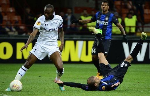 Rodrigo Sebastian Palacio (right) fights for the ball with William Gallas in Milan on March 14, 2013