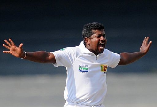 Sri Lanka&#039;s Rangana Herath appeals for a wicket during the second Test against Bangladesh in Colombo, on March 16, 2013