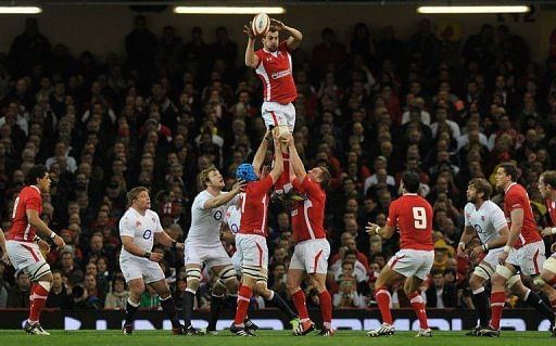 Wales&#039;s flanker Sam Warburton (C) takes the ball during a line-out in Cardiff on March 16, 2013