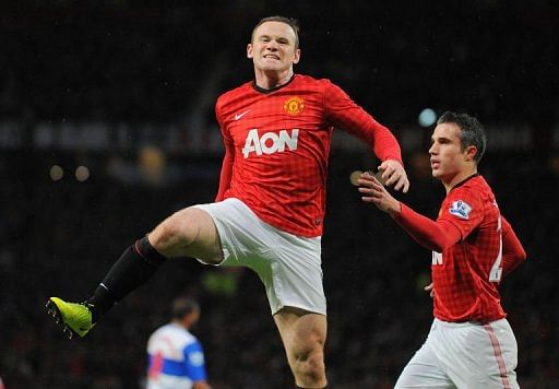 Manchester United&#039;s forward Wayne Rooney (L) celebrates after scoring at Old Trafford in Manchester, March 16, 2013