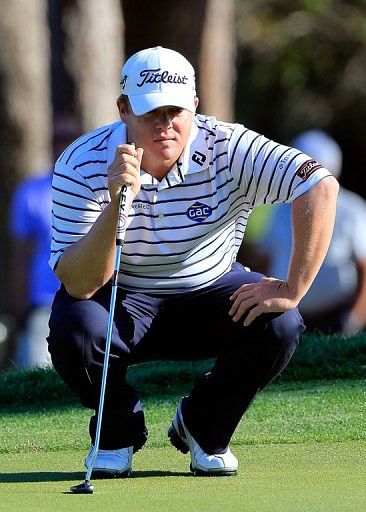George Coetzee of South Africa looks over a shot on the 18th hole on March 16, 2013 on Palm Harbor, Florida