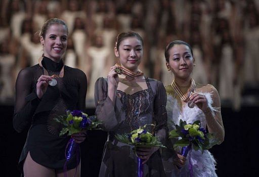 Carolina Kostner (L), Kim Yu-na (C) and Mao Asada at the World Figure Skating Championships on March 16, 2013