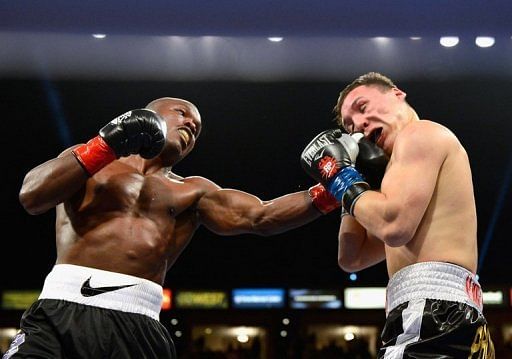 Timothy Bradley (L) lands a punch during his WBO welterweight title fight against Ruslan Provodnikov on March 16, 2013