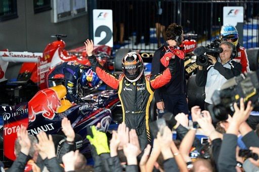 Kimi Raikkonen celebrates winning the season-opening Australian Formula One GP, in Melbourne, on March 17, 2013