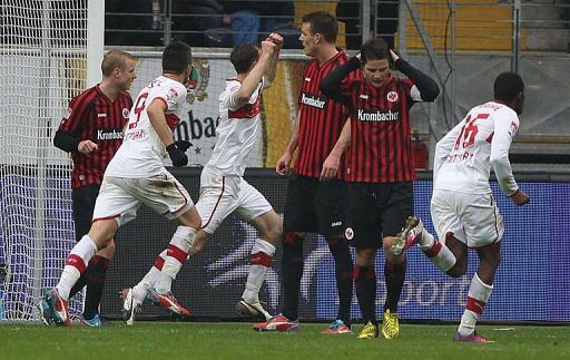 Frankfurt&#039;s players react as Stuttgart&#039;s Georg Niedermeier (3rd L) celebrates in Frankfurt am Main on March 17, 2013