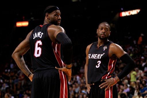LeBron James and Dwyane Wade of the Miami Heat look on during the game against the Orlando Magic on March 6, 2013