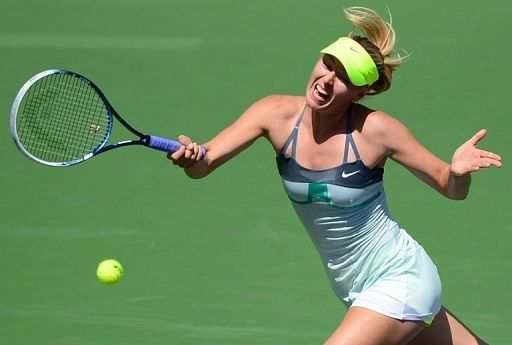 Maria Sharapova hits a return to Caroline Wozniacki on March 17, 2013 at Indian Wells