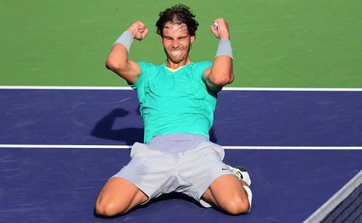 Rafael Nadal drops to his knees celebrating victory over Juan Martin del Potro on March 17, 2013 at Indian Wells