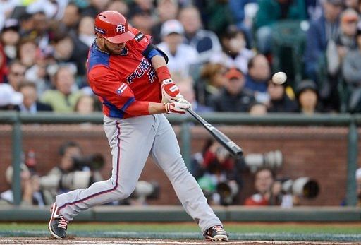 Mike Aviles of Puerto Rico hits an RBI single during their World Baseball Classic game against Japan on March 17, 2013