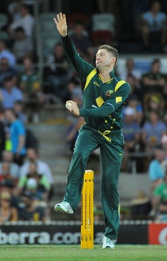 Michael Clarke bowls during a one-day International cricket match in Canberra on February 6, 2013