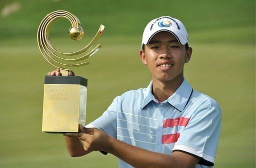 Guan Tianlang celebrates after winning the Asia-Pacific Amateur Championship in Chonburi. on November 4, 2012