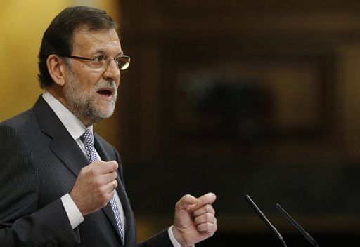 Spain&#039;s Prime Minister Mariano Rajoy delivers a speech during a parliamentary debate in Madrid, on February 20, 2013