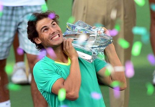 Rafael Nadal holds the championship trophy on March 17, 2013 in Indian Wells