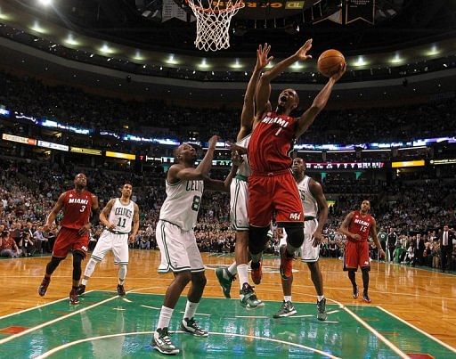 Chris Bosh of the Miami Heat beats Jeff Green of the Boston Celtics to the basket in the first half on March 18, 2013