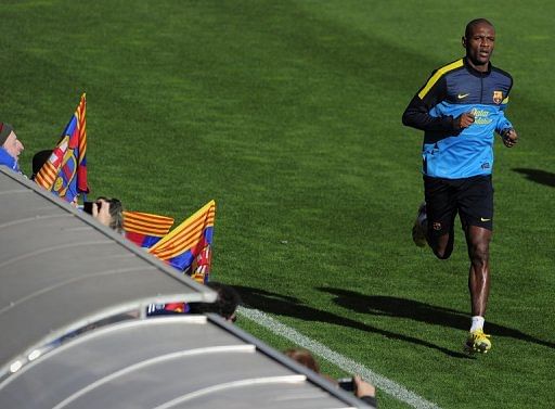 Eric Abidal takes part in an open training session at the Mini Stadium in Barcelona on January 4, 2013