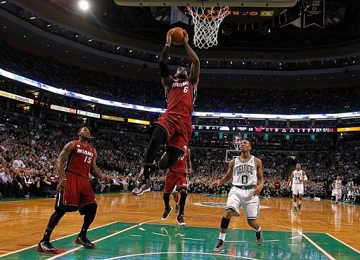 LeBron James of the Miami Heat scores by Avery Bradley of the Boston Celtics in the first quarter on March 18, 2013