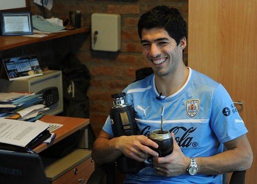 Luis Suarez smiles during an interview with AFP after a training session on March 19, 2013, in Montevideo