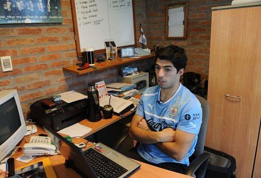 Luis Suarez speaks during an interview with AFP, after a training session on March 19, 2013, in Montevideo