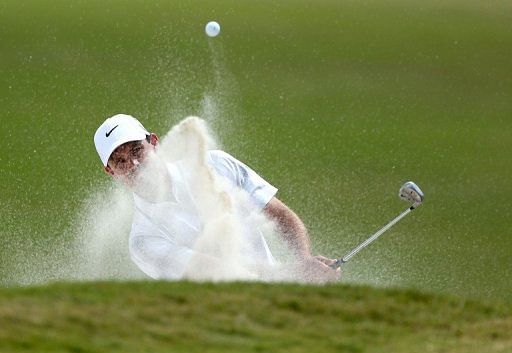 Charl Schwartzel plays a bunker shot at the WGC-Cadillac Championship on March 10, 2013