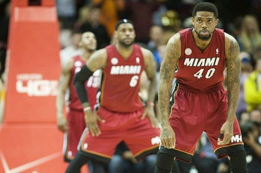 Udonis Haslem (R) and Lebron James wait for the tip-off against the Cleveland Cavaliers on March 20, 2013