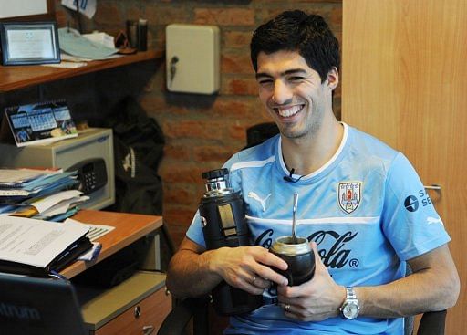 Luis Suarez smiles during an interview with AFP after a training session on March 19, 2013, in Montevideo