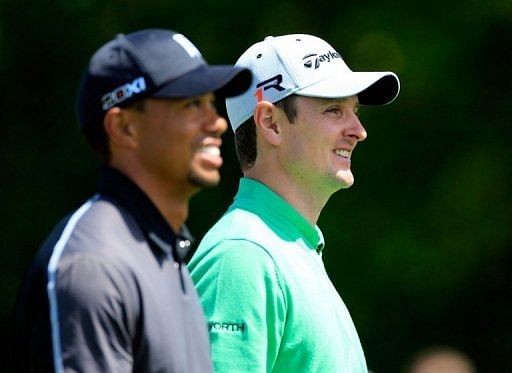 Tiger Woods (L) and Justin Rose, pictured in Orlando, on March 21, 2013