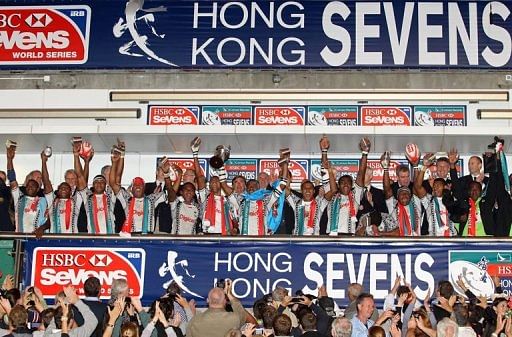 Last year&#039;s winners, Fiji, celebrate on the winners podium after beating N.Zealand, in Hong Kong, on March 25, 2012