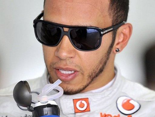 Lewis Hamilton drinks water during practice for the Japanese Grand Prix at the Suzuka circuit on October 6, 2012