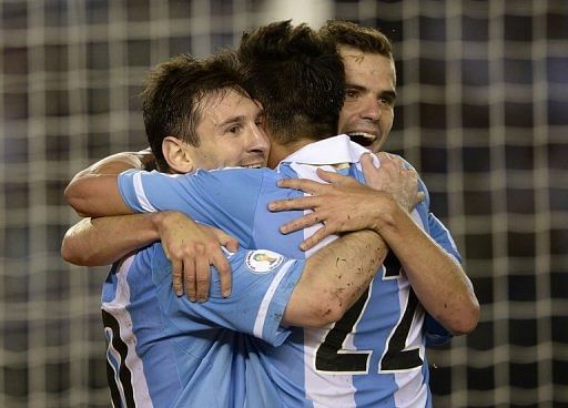 Argentina&#039;s players celebrate after scoring a penalty against Venezuela, in Buenos Aires, on March 22, 2013