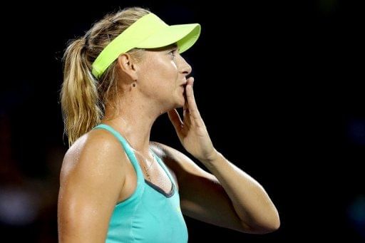 Sharapova cruises through as Azarenka withdraws