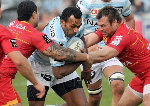 Racing Metro&#039;s Bobo Sireli (C) collapses with Perpignan&#039;s Nicolas Mas (R), March 23, 2013 in Colombes