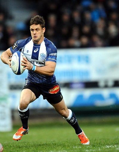 Castres&#039; scrum half Rory Kockott runs with the ball at the Pierre Antoine stadium in Castres on March 23, 2013