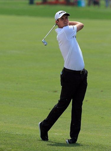 Justin Rose of England plays his second shot on the 1st hole at Bay Hill Golf and Country Club on March 23, 2013