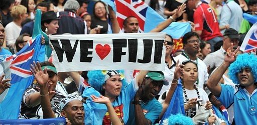 Fijian fans cheer as their team plays against New Zealand during the Hong Kong Rugby Sevens tournament on March 24, 201