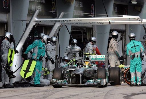 Mercedes driver Lewis Hamilton leaves after a pitstop during the Formula One Malaysian Grand Prix ,Sepang,March 24, 2013