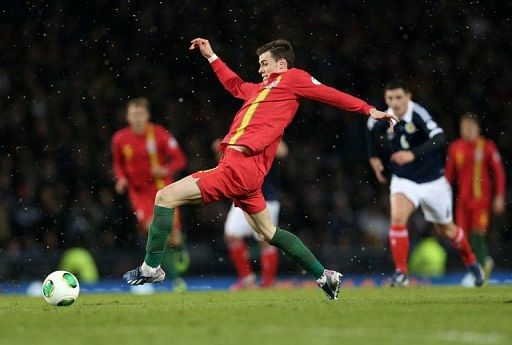 Gareth Bale of Wales sin a World Cup qualifier at Hampden Stadium, Glasgow, Scotland, on March 22, 2013