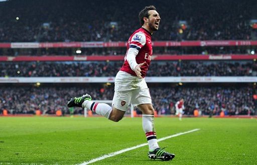 Arsenal&#039;s Santi Cazorla celebrates scoring at the Emirates Stadium in London on February 23, 2013