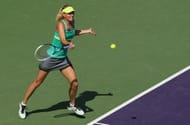Maria Sharapova plays a forehand against Elena Vesnina on March 24, 2013 in Key Biscayne, Florida