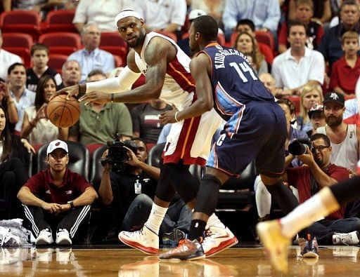 Miami&#039;s LeBron James (L) and Charlotte Bobcats&#039; Michael Kidd-Gilchrist is pictured during their game on March 24, 2013