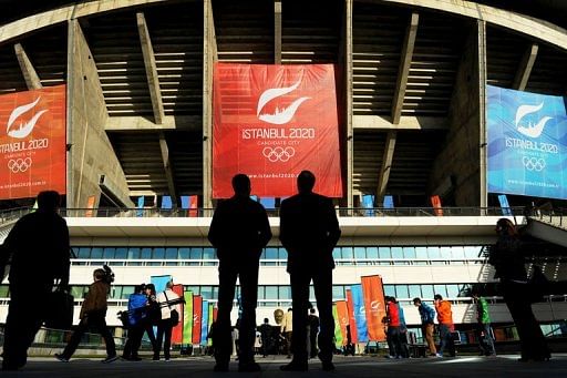 Members of the media enter the Ataturk Olympic Stadium on March 24, 2013 in Istanbul