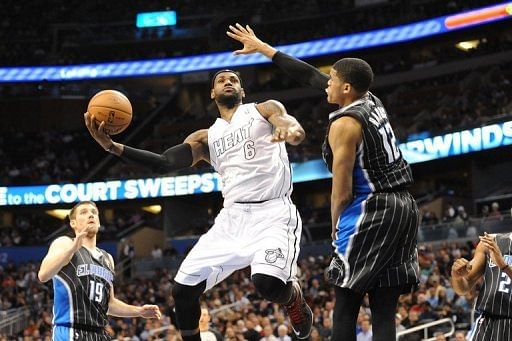 LeBron James shoots over Tobias Harris on March 25, 2013
