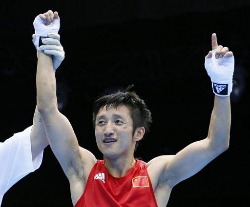 Zou Shiming is declared the victor after defeating Paddy Barnes at the London Olympics on August 10, 2012