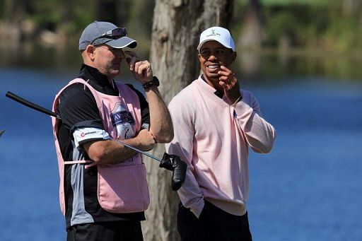 Tiger Woods with caddie Joe LaCava during the final day of the 2013 Tavistock Cup Matches on March 26, 2013 in Orlando