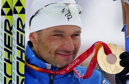 Andrus Veerpalu of Estonia celebrates on the podium of the men's 15km classical of the 2006 Winter Olympics