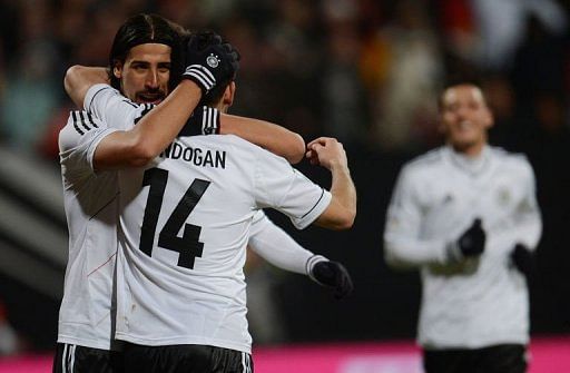 Germany&#039;s Holger Badstuber and Sami Khedira (L) celebrate scoring in Nuremberg, on March 26, 2013