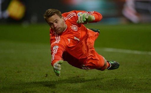German goalkeeper Manuel Neuer dives for a ball in Nuremberg, on March 26, 2013