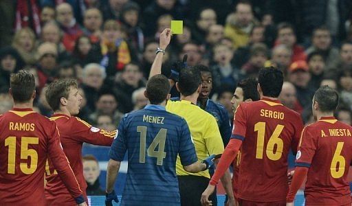 France midfielder Paul Pogba receives a yellow card during the World Cup qualifier against Spain on March 26, 2013