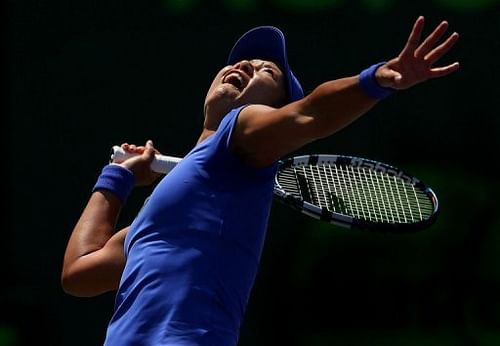 Li Na in action against Serena Williams at the Miami Masters on March 26, 2013