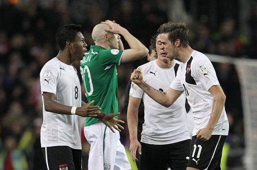 Austria&#039;s Martin Harnik (R) and David Alaba celebrate at the final whistle on March 26, 2013