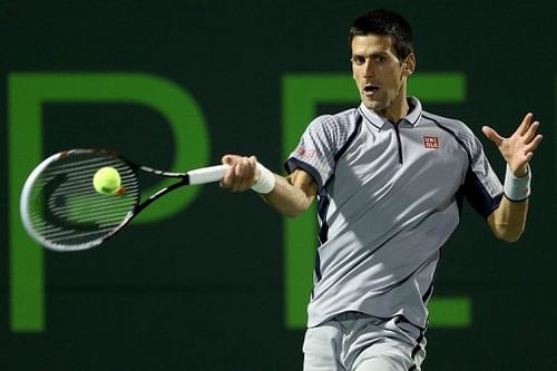 Novak Djokovic returns a shot to Tommy Haas at the Miami Masters on March 26, 2013